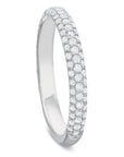 A white-colored diamond eternity ring with a continuous row of round-cut diamonds on a white background. angled