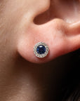 modeled image of blue sapphire stud with a diamond halo.