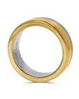 Gold and silver ring on a white background side profile view