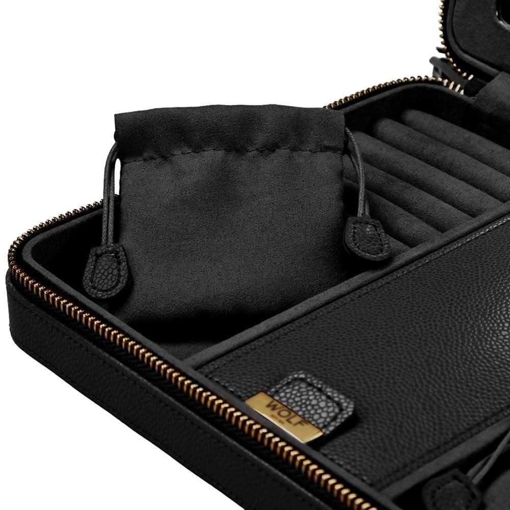 Black leather zippered travel case with a matching black fabric drawstring pouch inside, shown open on a white background. The case has gold-tone zippers, interior roll slots, and a small gold brand plaque reading WOLF.