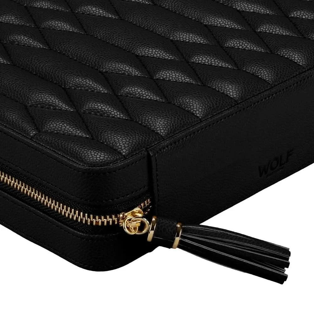 Black quilted leather jewelry travel case with a gold zipper, black leather tassel, and debossed WOLF logo on the side, shown on a white background.