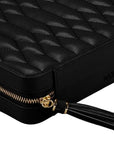 Black quilted leather jewelry travel case with a gold zipper, black leather tassel, and debossed WOLF logo on the side, shown on a white background.