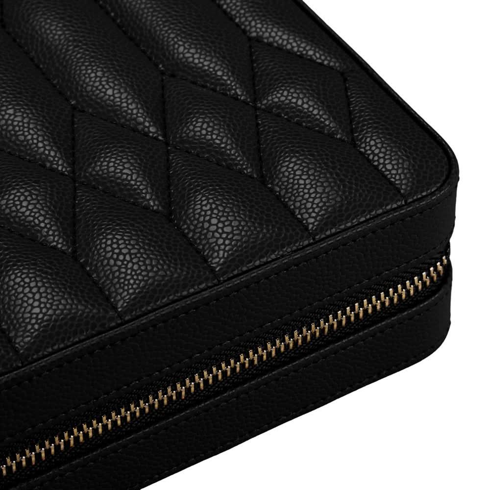 Close-up of a black quilted leather zip-around case with a gold-tone zipper, shown on a white background.