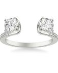 A Frederick Goldman diamond ring enhancer crafted in 14k white gold, featuring an open-gap bypass shank design showcasing two four-prong set round brilliant diamonds framing the opening with diamond accents along the polished shoulders.