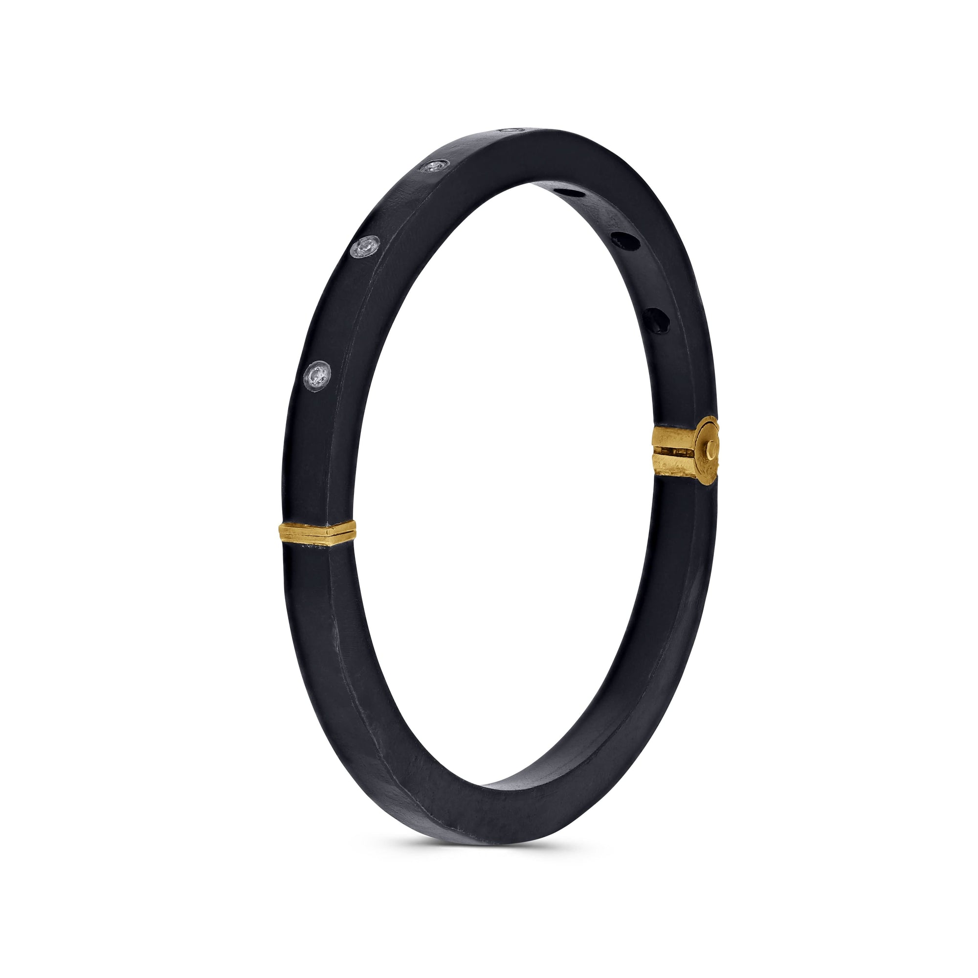 Black bracelet with gold accents on a white background