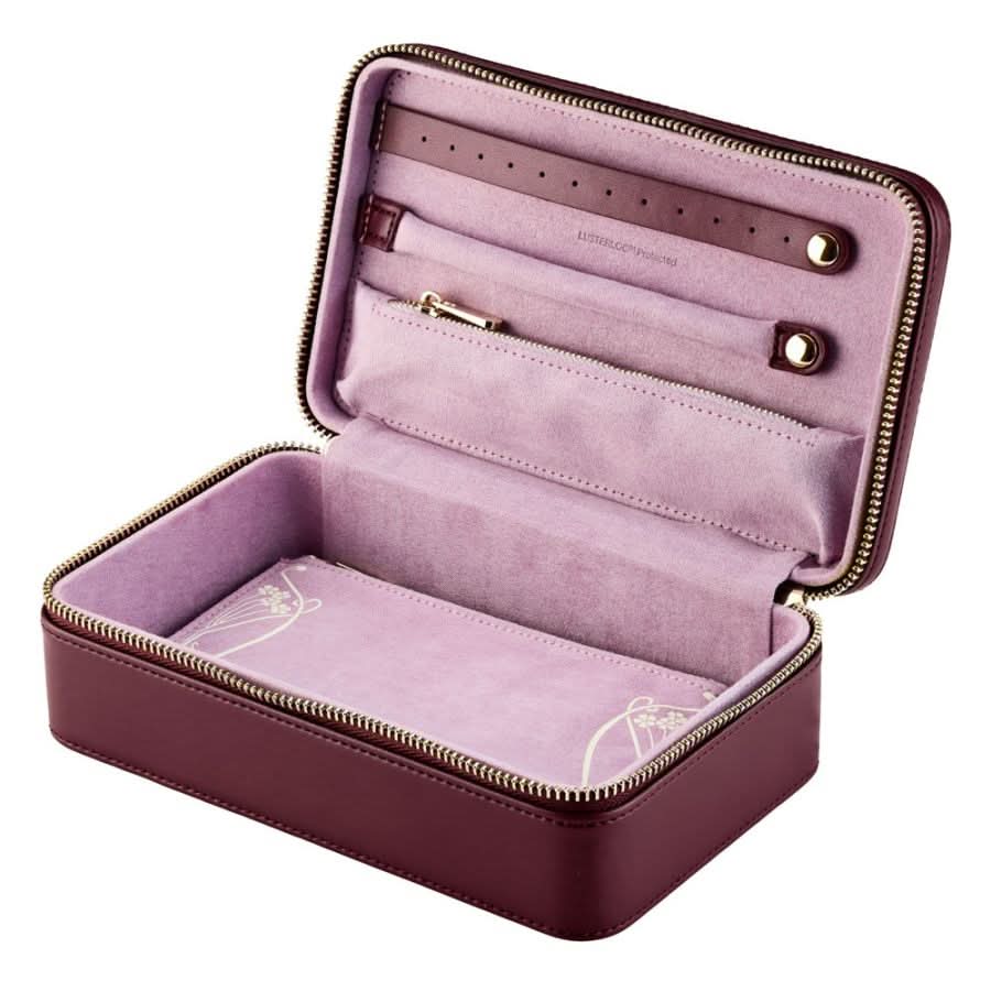 pink  jewelry case with open lid on a white background