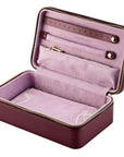 pink  jewelry case with open lid on a white background