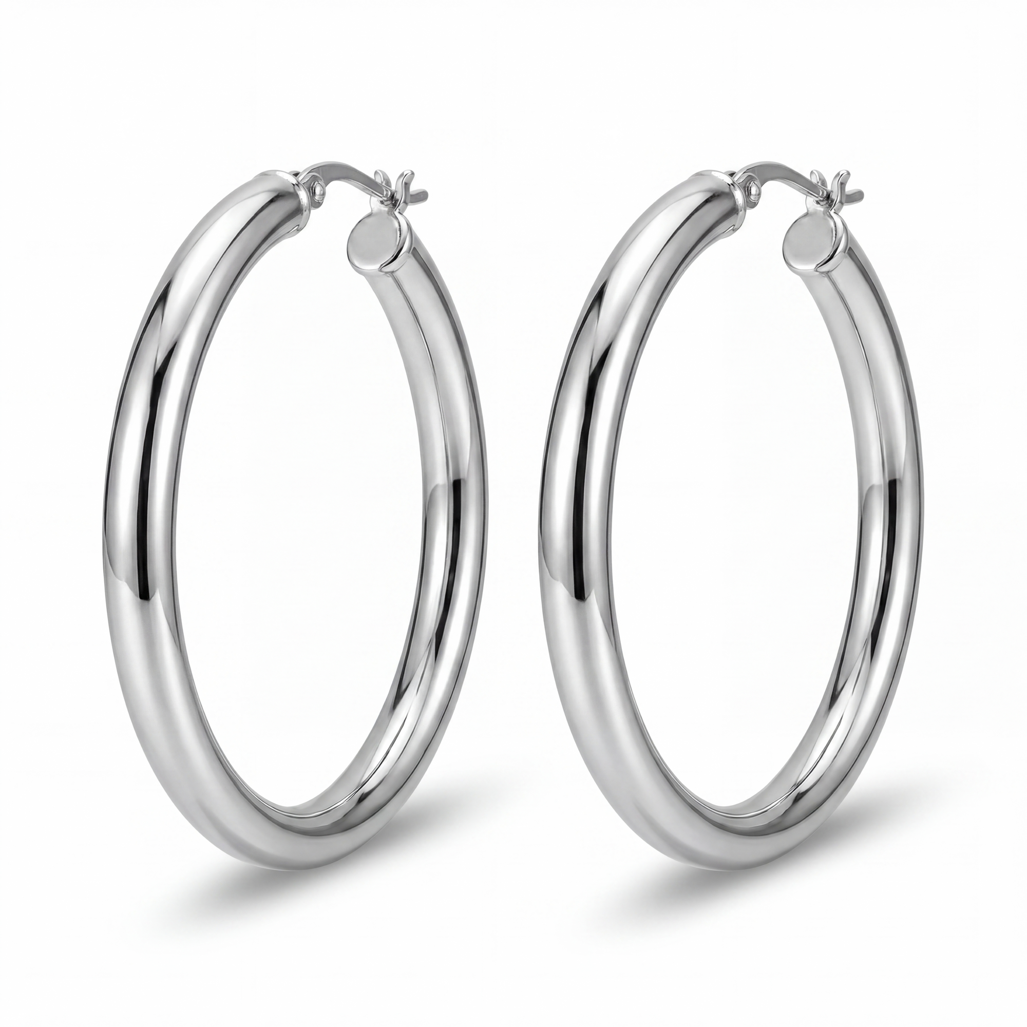 Pair of silver hoop earrings on a white background