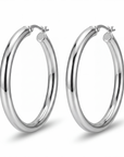 Pair of silver hoop earrings on a white background