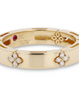 A Roberto Coin Love in Verona stackable band in polished 18K yellow gold, featuring repeating four-petal diamond floral motifs totaling 0.09 carats.
