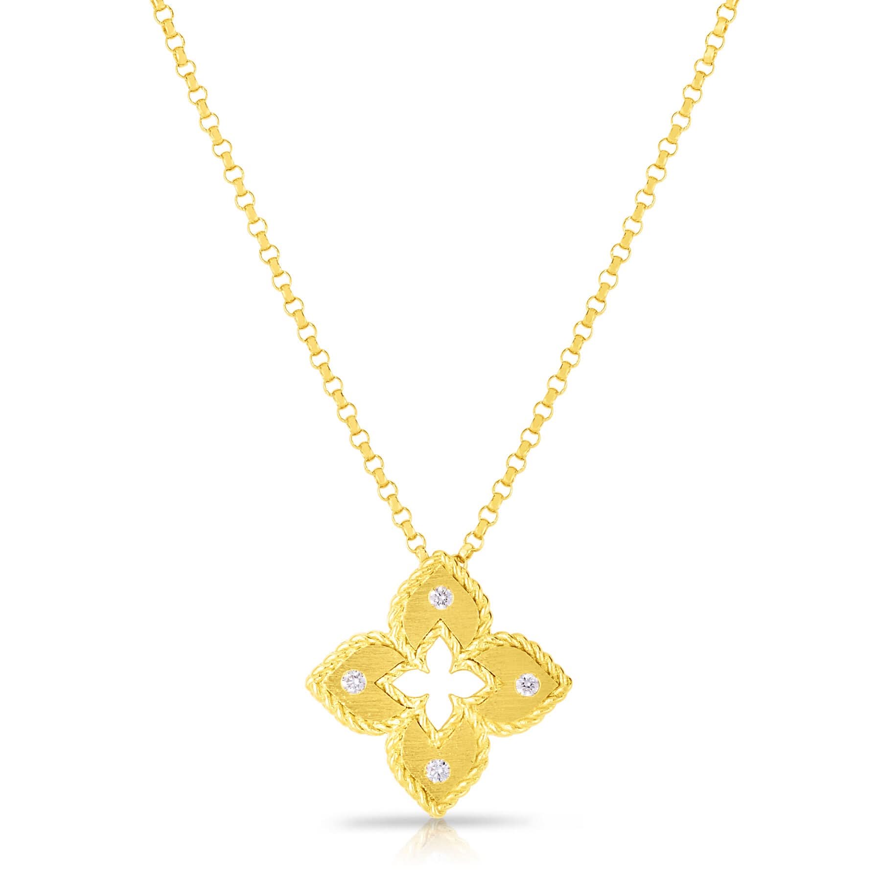 A detailed front view of the Roberto Coin Venetian Princess small flower pendant necklace in 18k yellow gold (Reference 7772985AYCHX), showcasing its extra-small open four-petal flower motif accented by a matte satin-brushed finish and four shimmering diamond tips, suspended from a fine adjustable gold chain against a clean white background.