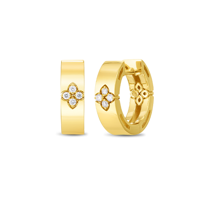 Gold hoop earrings with floral designs and clear stones on a white background