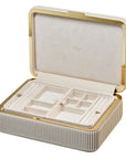 Beige jewelry box with gold accents opened on a white background