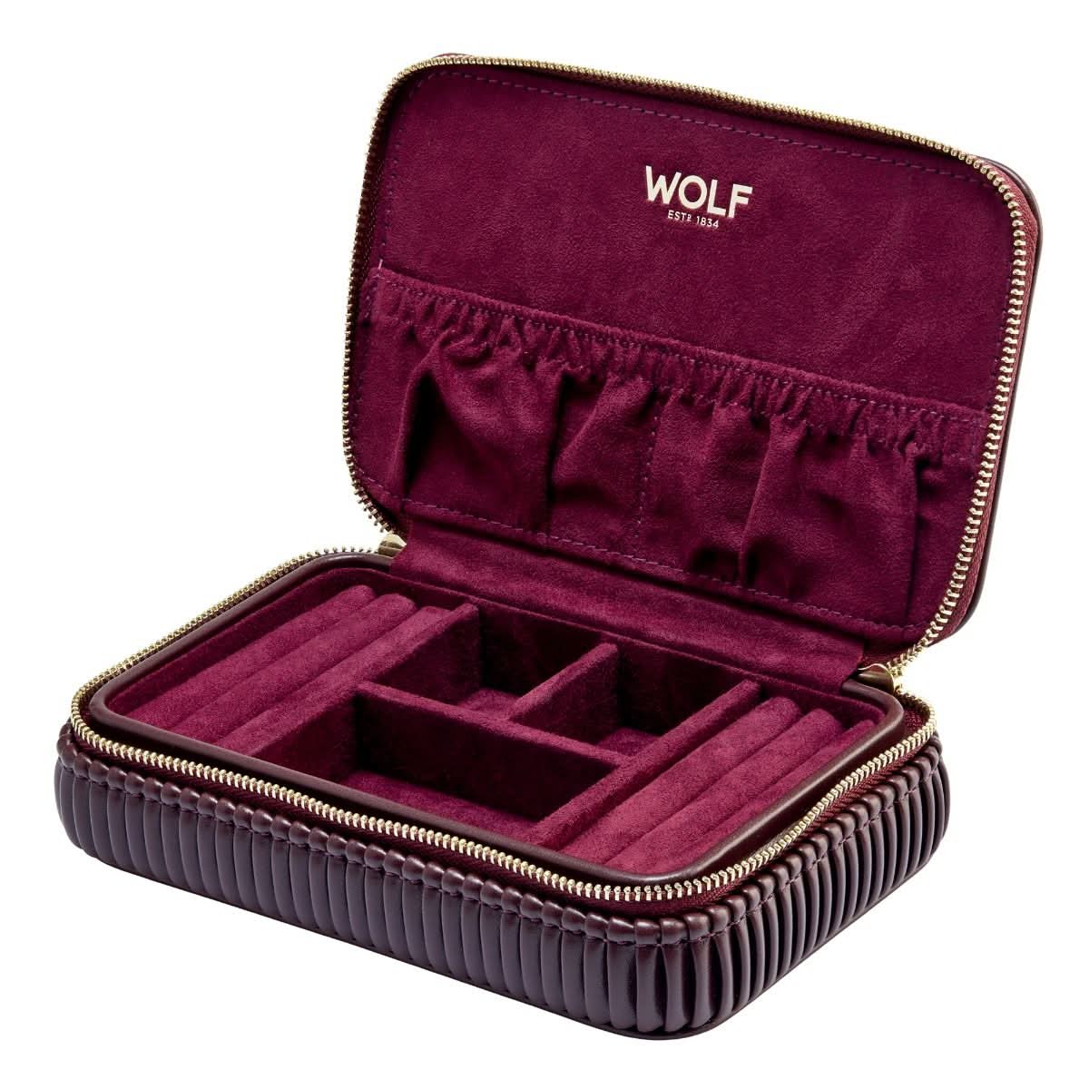Open burgundy jewelry case with compartments and 'WOLF' branding on a white background