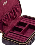 Maroon jewelry case with gold zipper and 'WOLF' branding on a white background