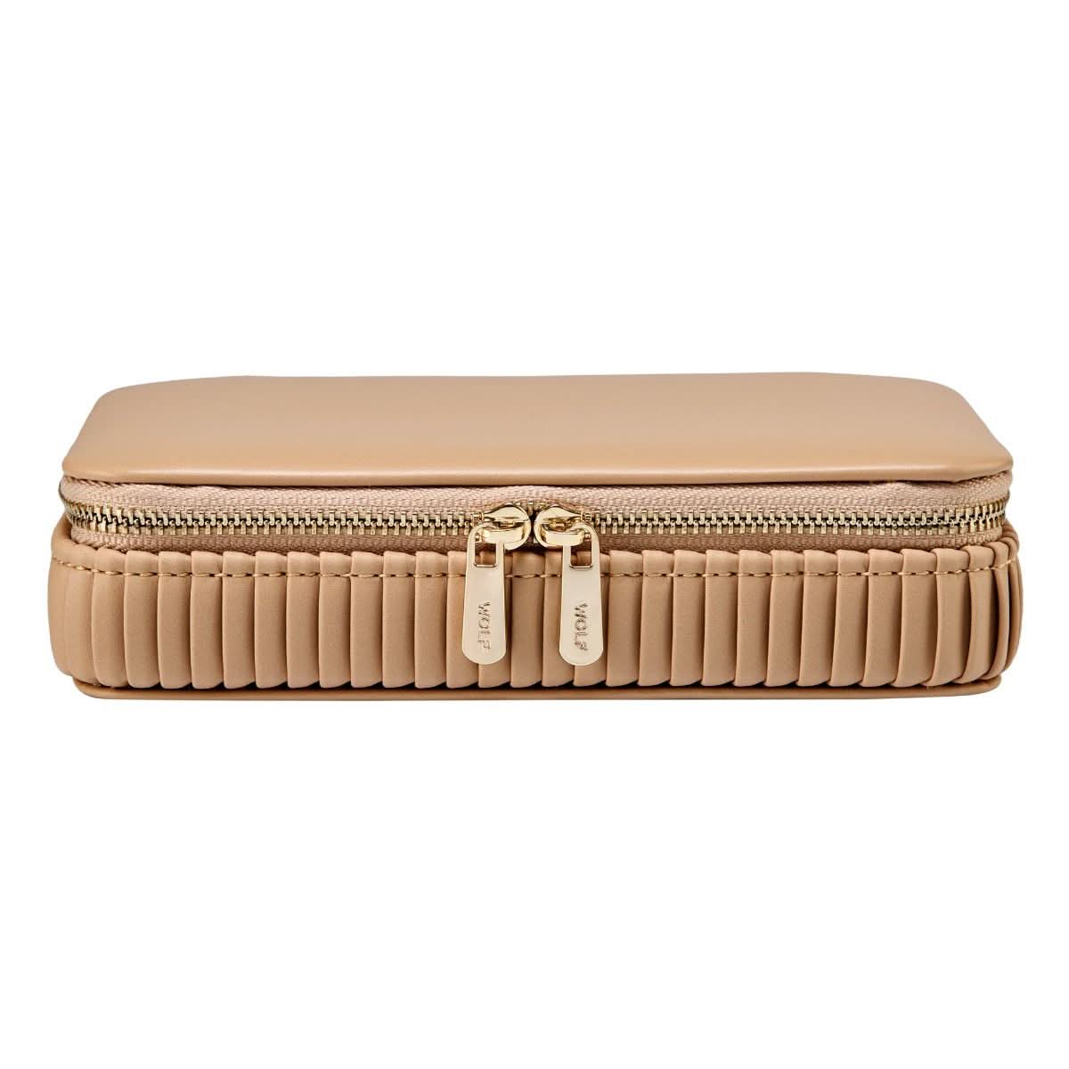 Beige travel case closed with gold zipper front view on a white background