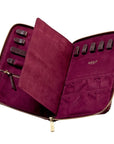 Purple jewelry case open showing holders, brand 'WOLF' visible, on a white background