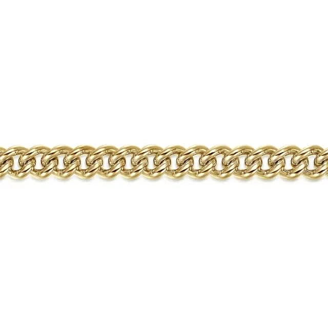Gold curb chain on a white background close up