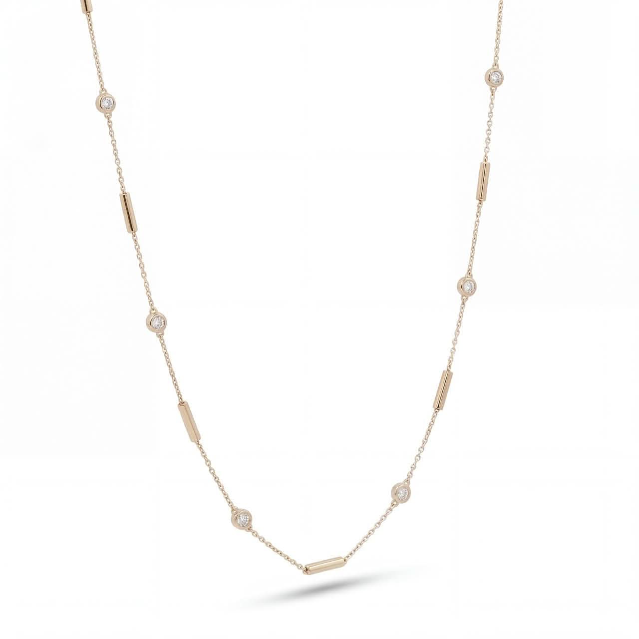 Gold necklace with small diamonds and gold bars on a white background