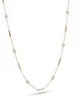 Gold necklace with small diamonds and gold bars on a white background
