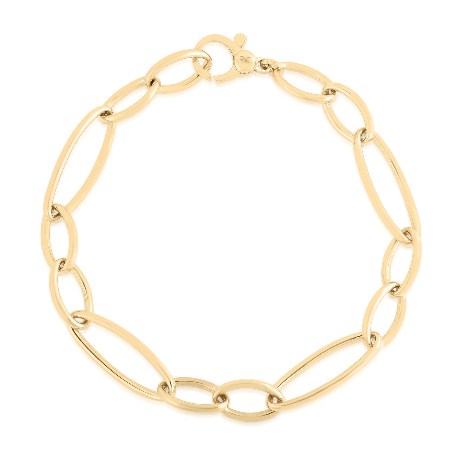A yellow gold link bracelet with elongated oval links and a spring-ring clasp, shown on a plain white background.