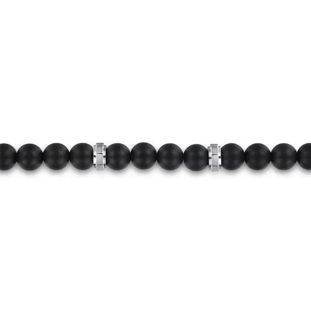Black beaded bracelet with silver clasp on a white background