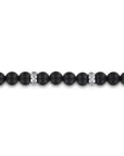 Black beaded bracelet with silver clasp on a white background