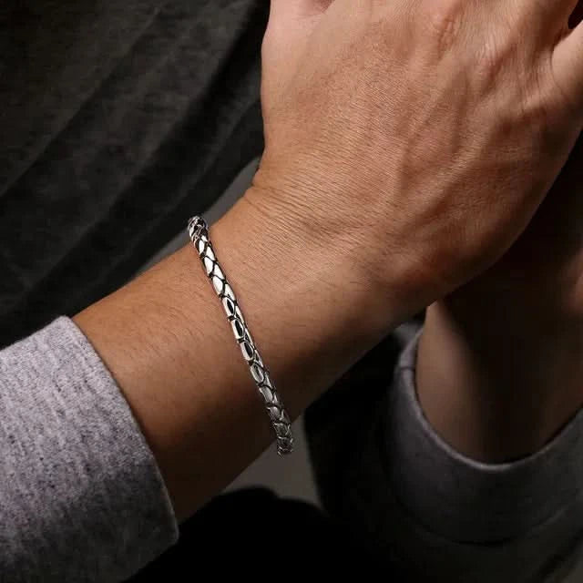 Silver bracelet on a wrist 