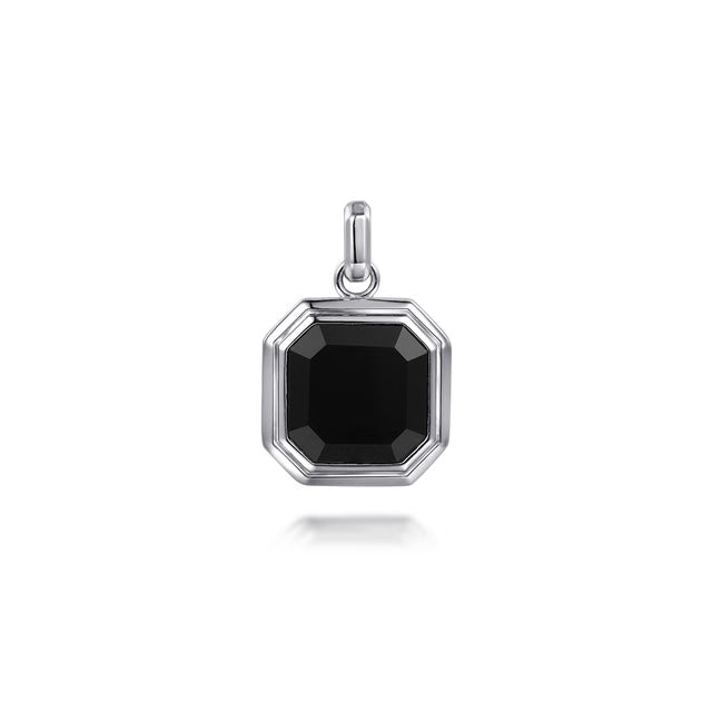 A silver octagonal pendant featuring a faceted black gemstone, shown on a clean white background with a subtle reflection below.