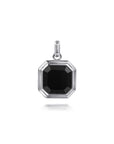 A silver octagonal pendant featuring a faceted black gemstone, shown on a clean white background with a subtle reflection below.