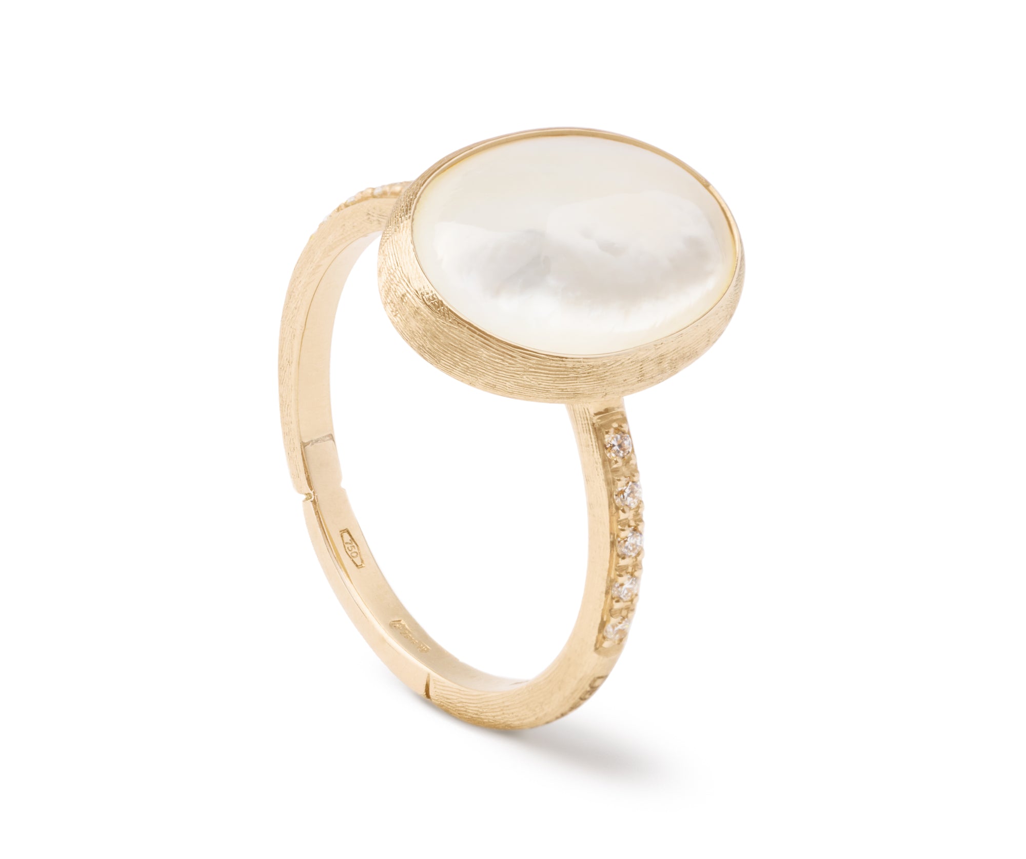 Gold ring with a large white mother of pearl stone on a white background
