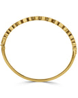 Gold bracelet side view on a white background