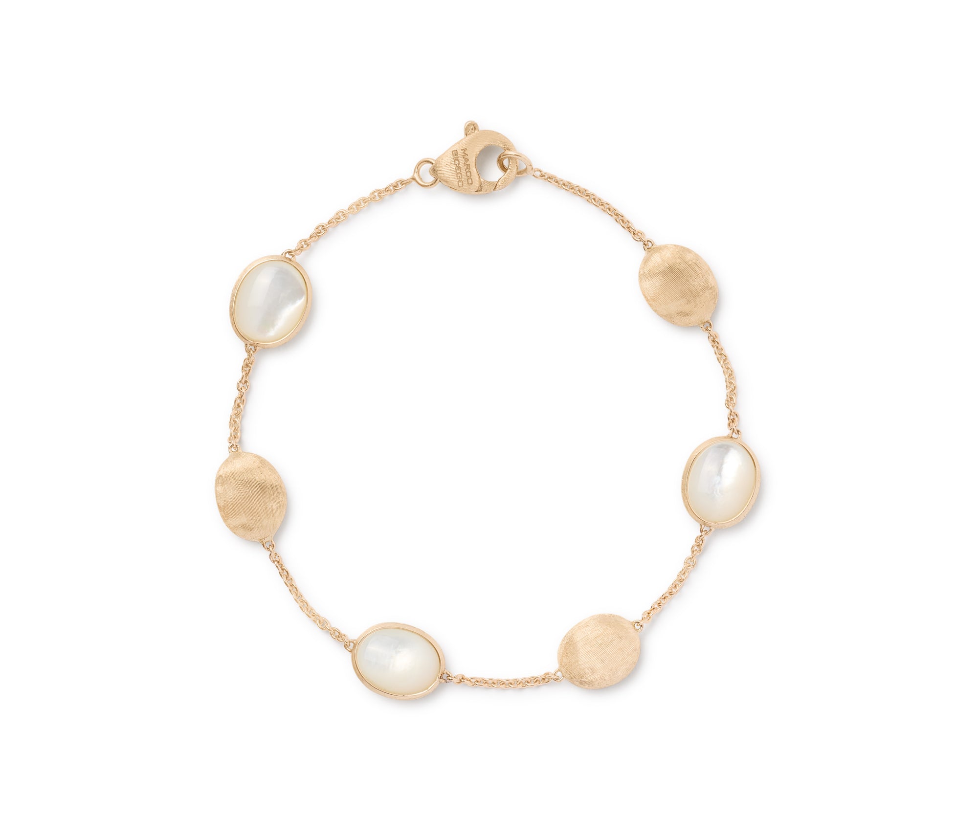gold bracelet with mother of pearl stones on a white background
