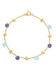 Gold bracelet with multicolored beads on a white background
