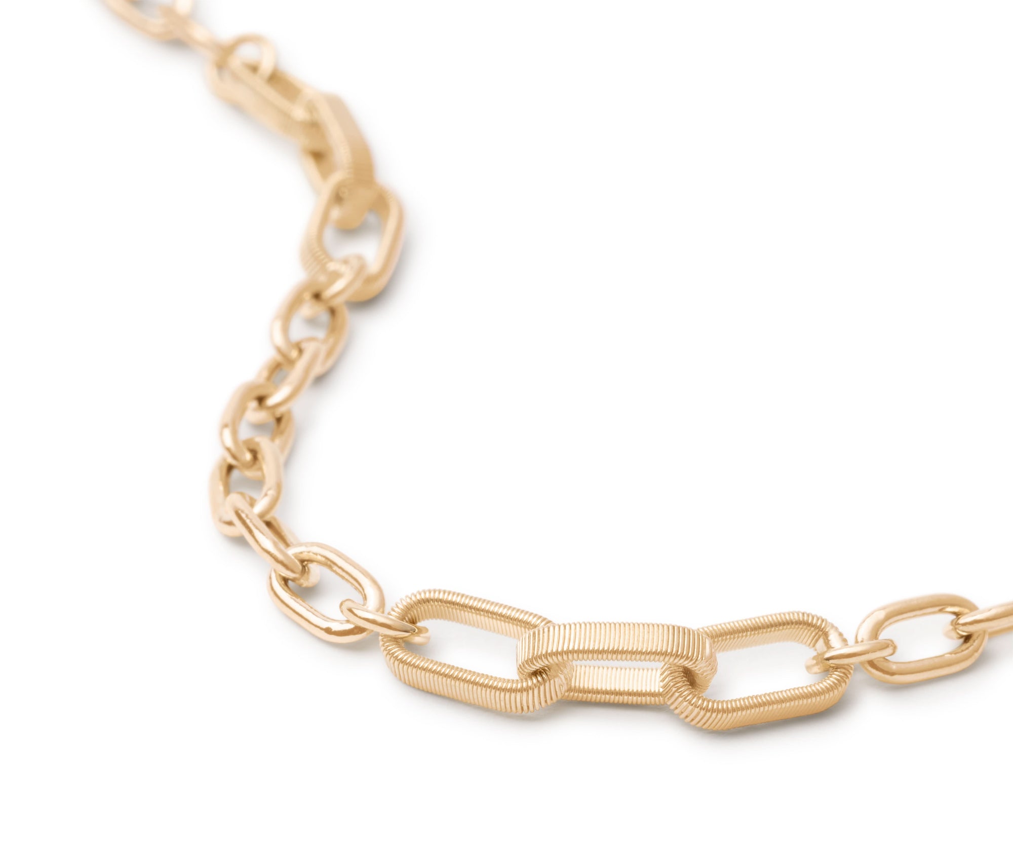 Gold chain necklace on a white background close up