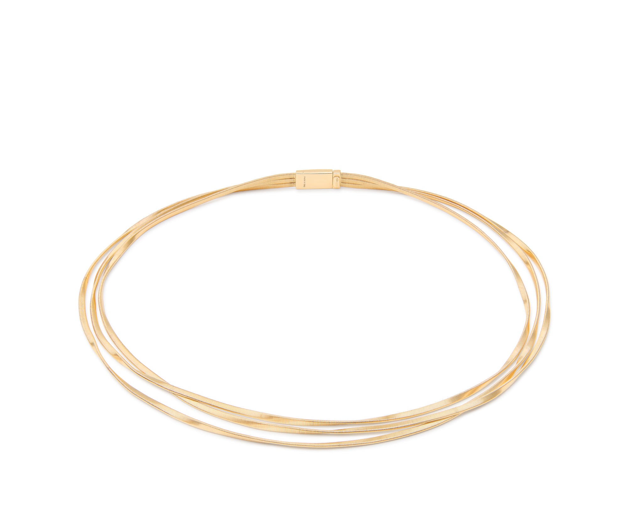 gold three strand necklace on white background
