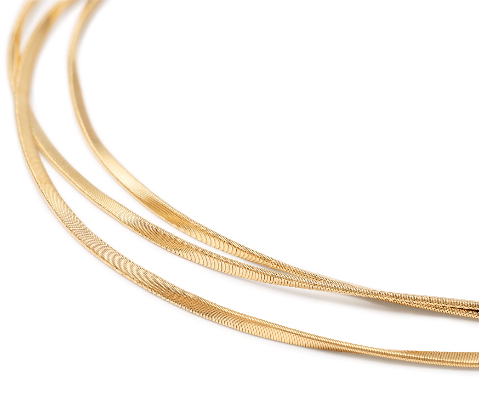 Three gold strands on a white background