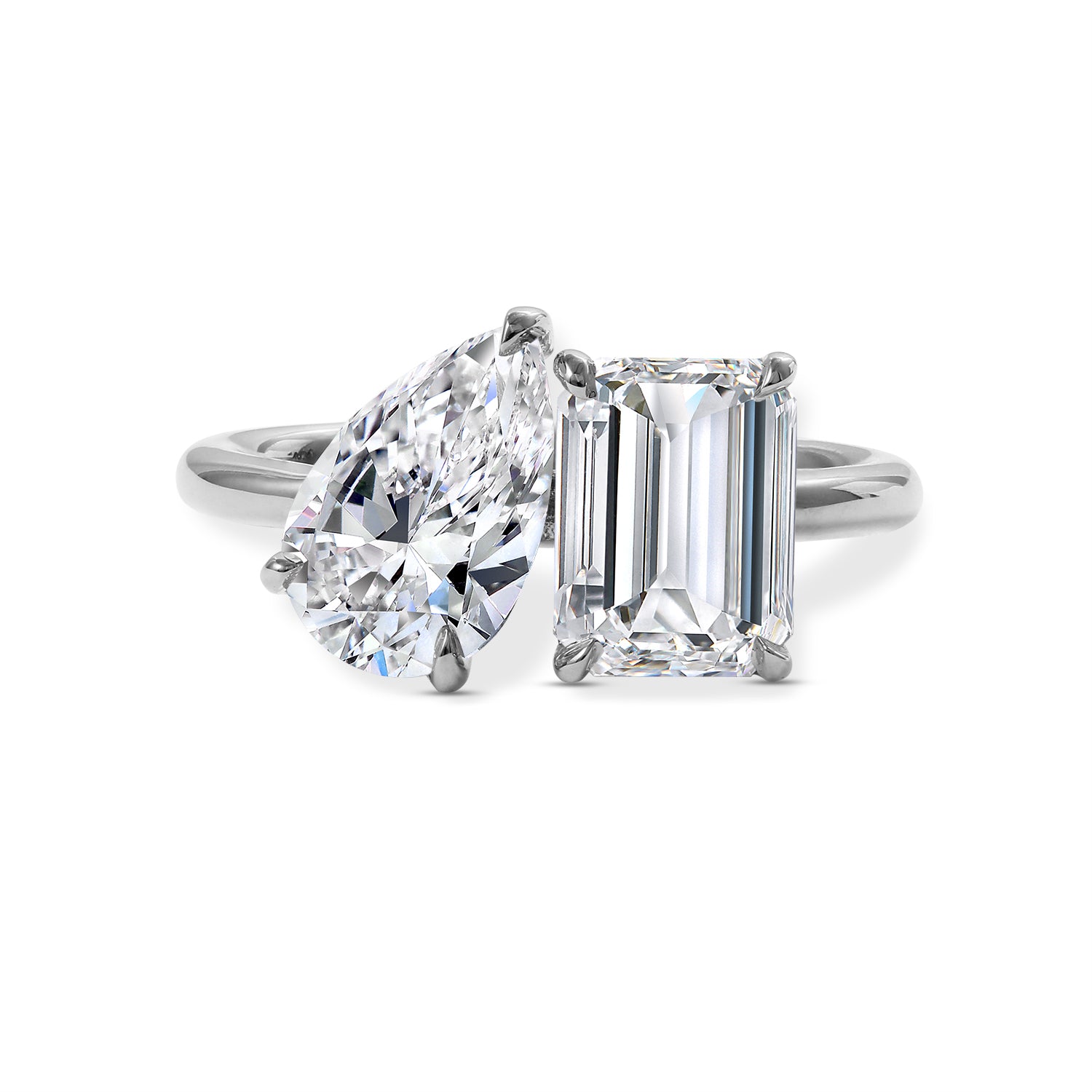 lab created Diamond ring with heart-shaped and emerald-cut diamonds on a white background