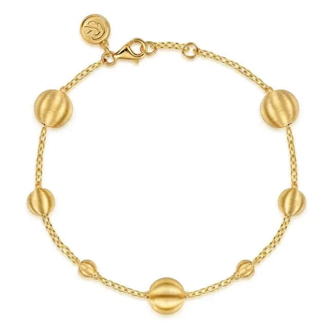 Gold alternating Bead Bracelet on white background