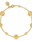 Gold alternating Bead Bracelet on white background