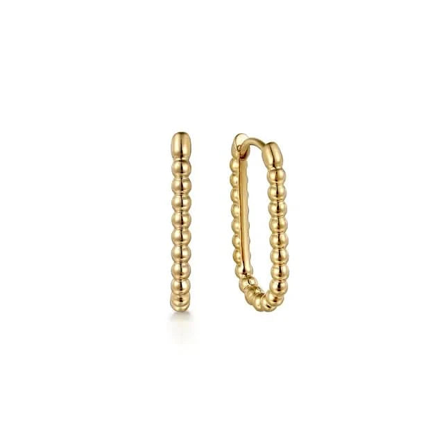 Gold hoop earrings on a white background