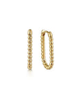 Gold hoop earrings on a white background