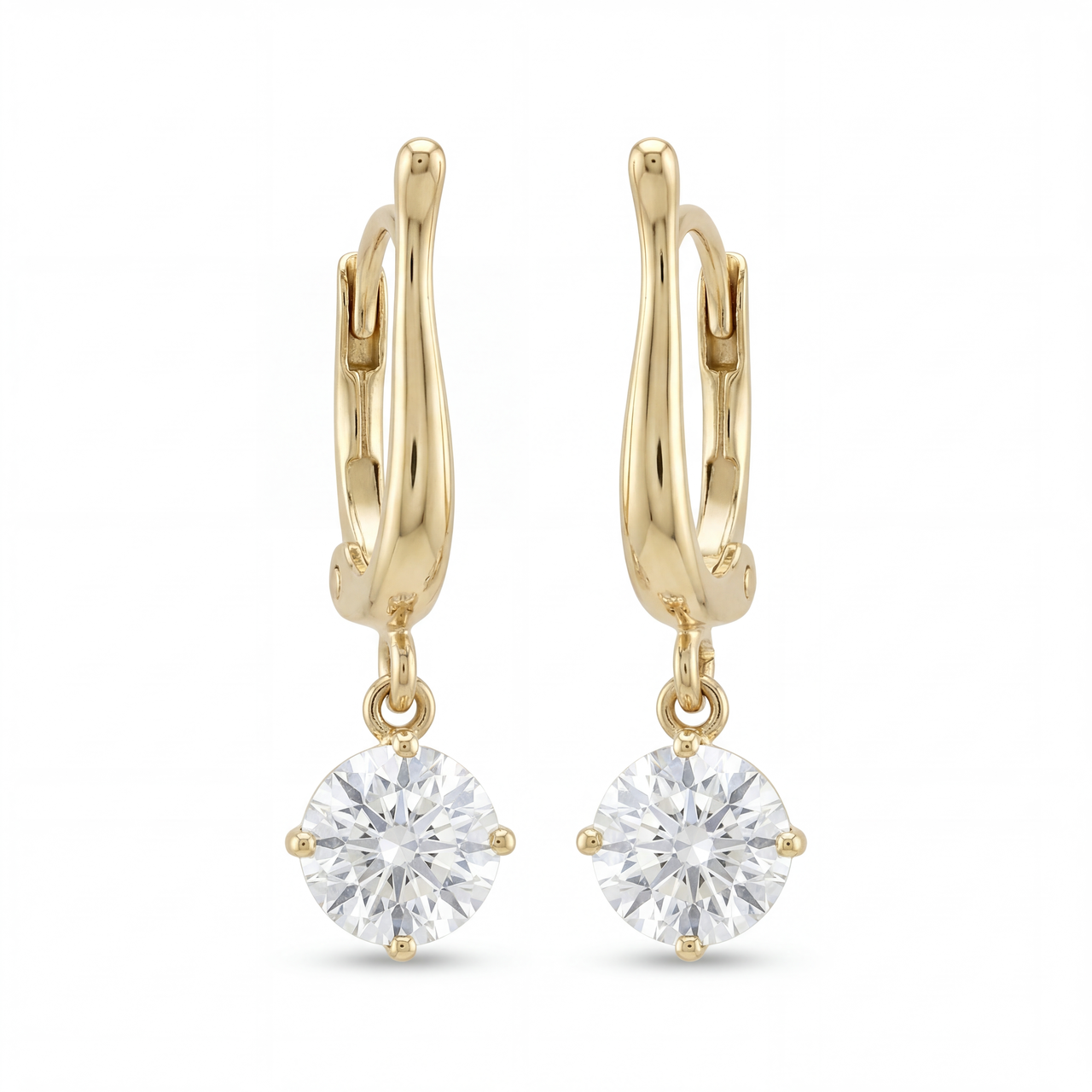 Gold hoop earrings with round clear gemstones on a white background