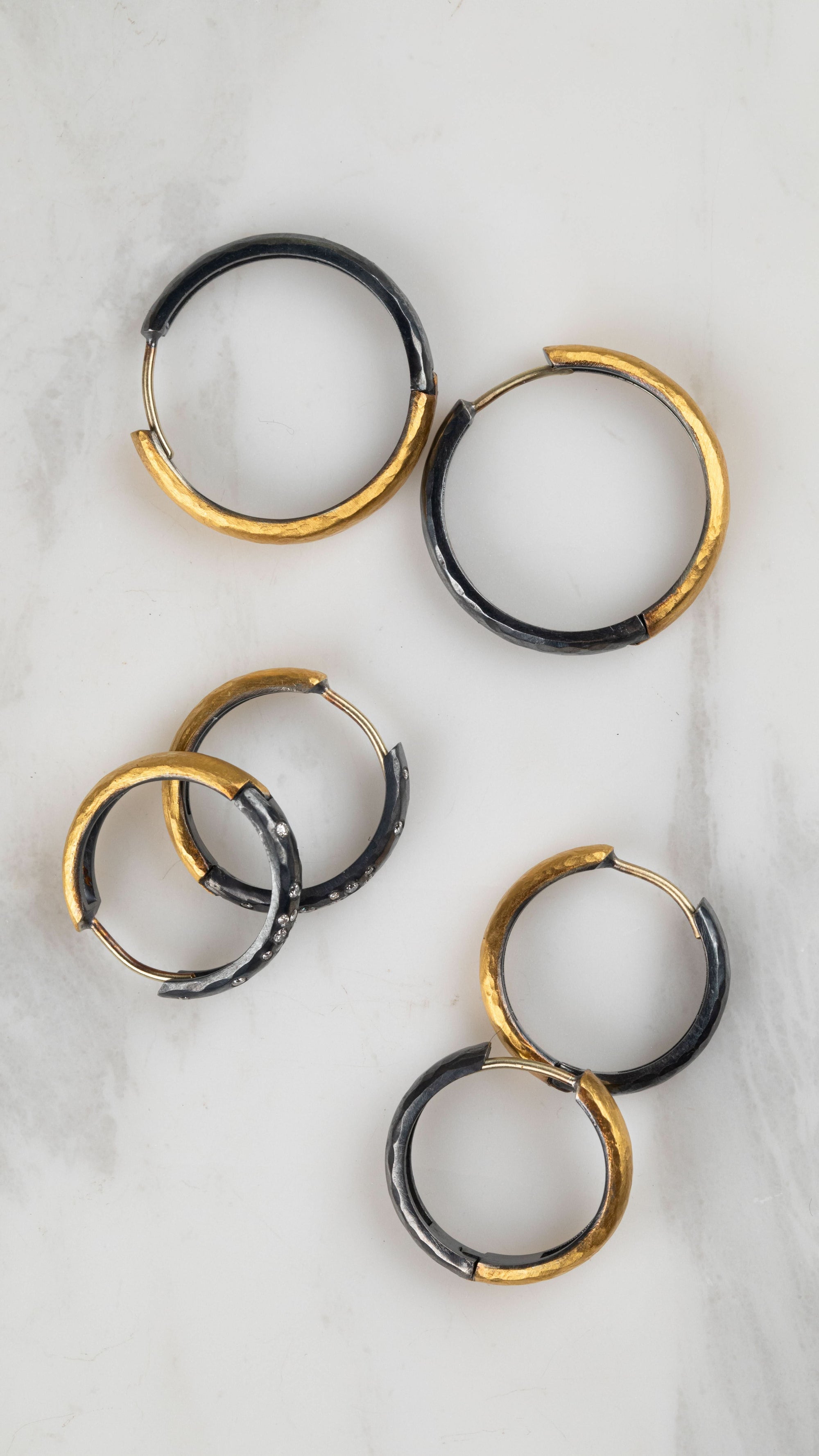 three pairs of yellow and black hoops