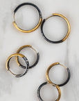 three pairs of yellow and black hoops