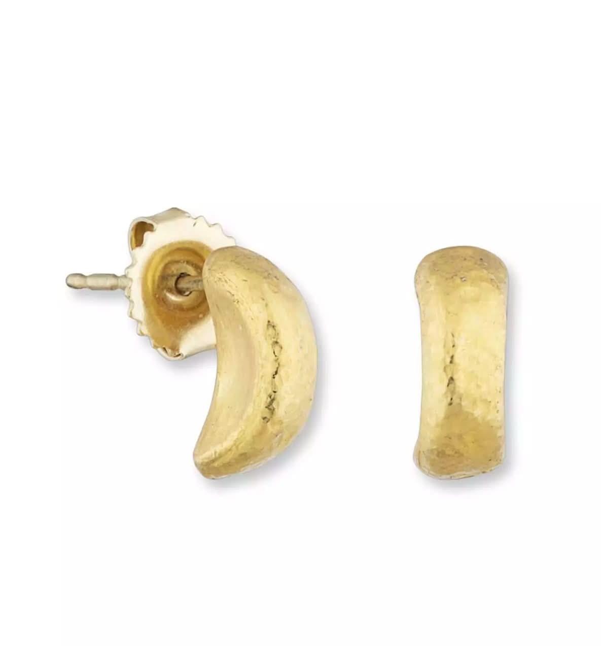A pair of Lika Behar "Half Drum" structural stud earrings in hand-hammered pure 24K yellow gold, showing the wide J-hoop front profile and a 14K gold friction butterfly backing.