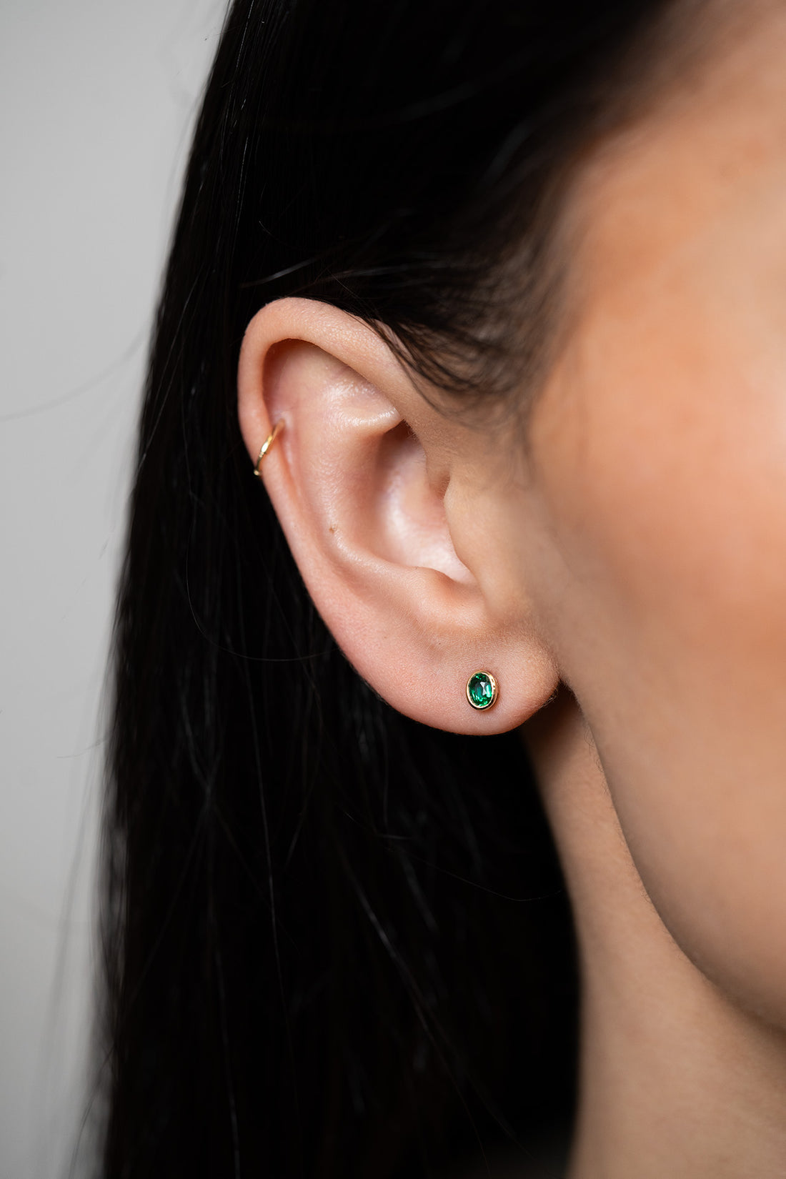 Oval Bezel Set Emerald Stud Earrings