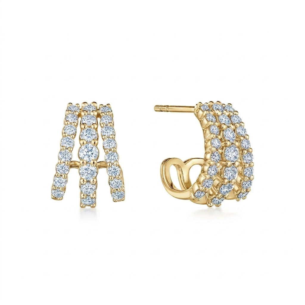 Gold earrings with diamond accents on a white background