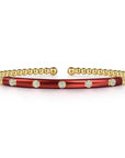 Bracelet with red and gold sections on a white background