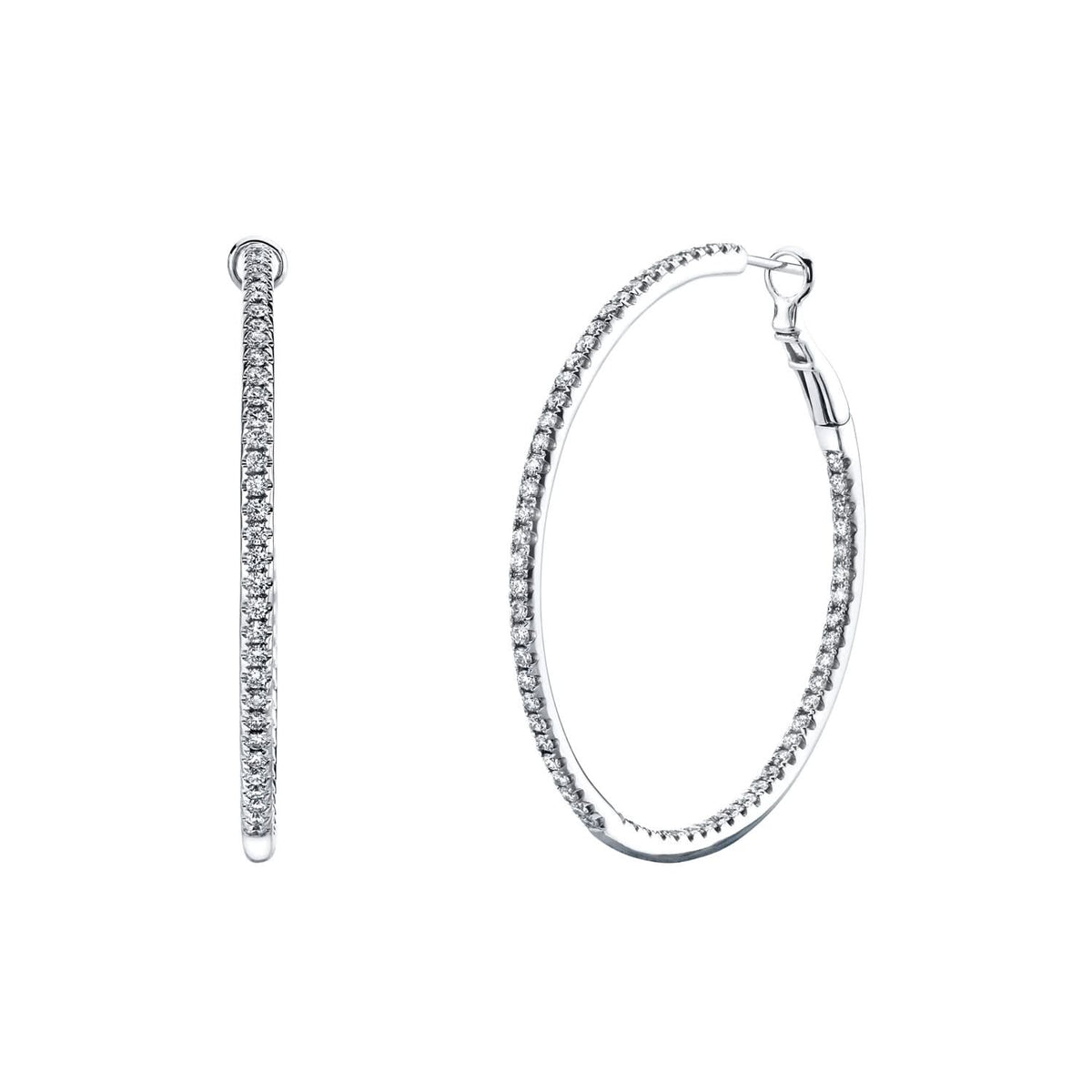 A pair of white gold hoop earrings, one shown in profile and the other in a three-quarter view, both featuring a pavé-set row of clear stones along the front edge, on a solid white background.